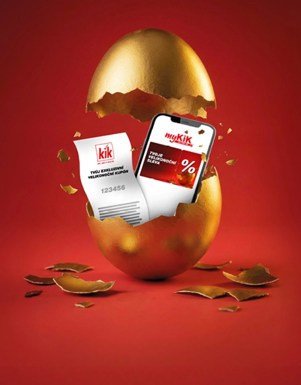 Zlaté vejce je prasklé a odhaluje chytrý telefon zobrazující slevovou nabídku a text „Rozbij zlaté vejce“.